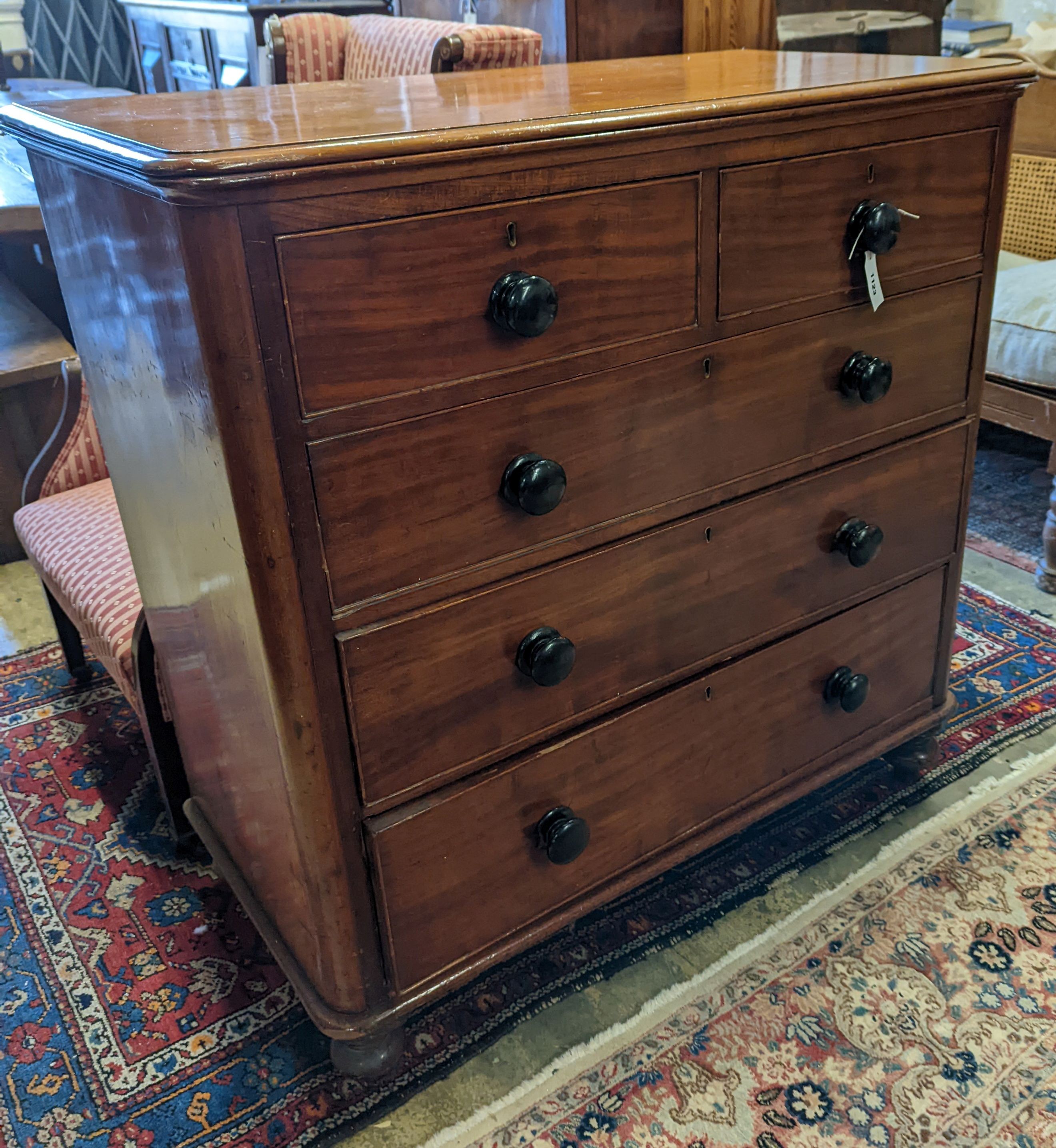 A mahogany chest of two short and three long drawers with turned handles, width 105cm, depth 53cm, height 106cm